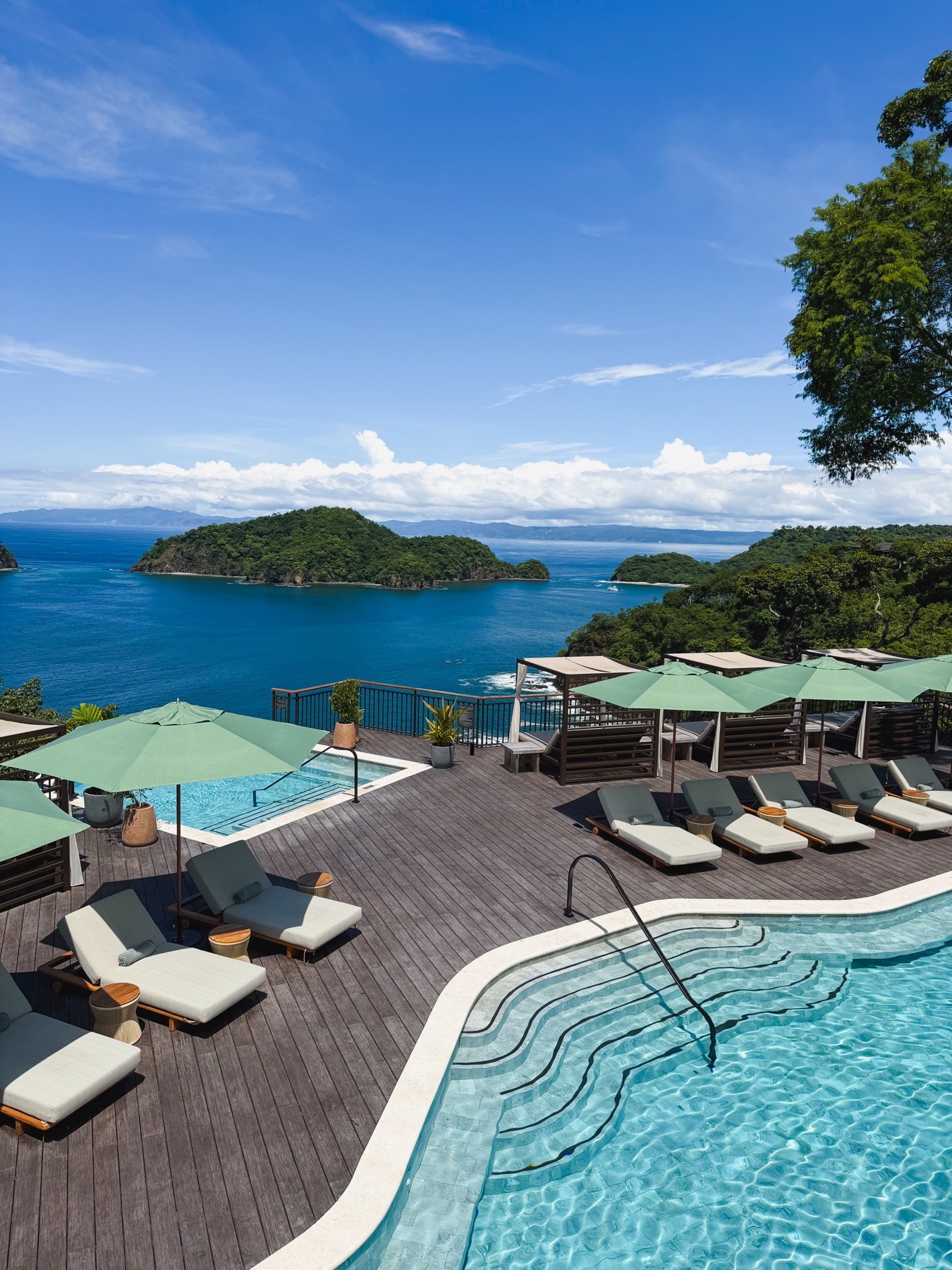 Oceanfront resort pools and terraces overlooking tropical islands